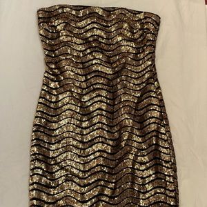 Unworn strapless gold and black sequined minidress